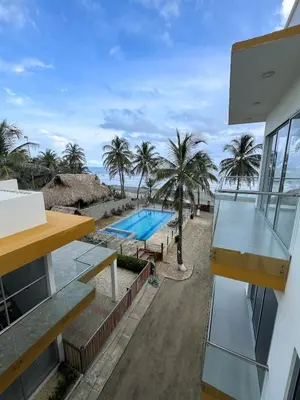 a view of the pool from the balcony of a house at 302 Apartamento frente al mar in San Bernardo del Viento