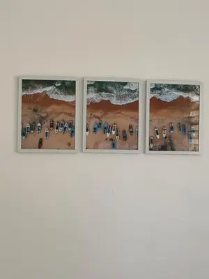a group of four pictures on a wall at 302 Apartamento frente al mar in San Bernardo del Viento