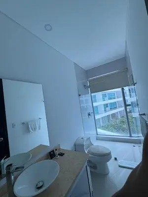 a bathroom with a sink and a toilet and a window at Apartamento en Cartagena a pasos de la Playa in Cartagena de Indias