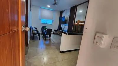 a kitchen and dining room with a table and chairs at Cabaña brisa de mar in San Silvestre
