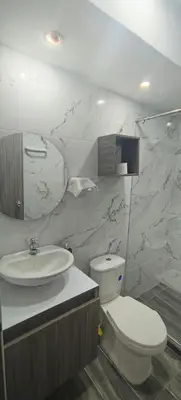 a bathroom with a toilet and a sink at Apto Hermoso Samu in Barranquilla