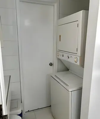 a white laundry room with a washer and dryer at Apto en Morros 3 con vista al Mar 504 in Cartagena de Indias