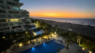 an aerial view of a beach at sunset with a hotel at Apto en Morros 3 con vista al Mar 504 in Cartagena de Indias