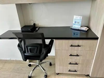 a desk with a chair and a desk with a laptop at Suite con vista al mar Cartagena CB808 in Cartagena de Indias