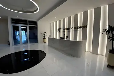 a lobby with a person sitting at a counter in a building at Suite con vista al mar Cartagena CB808 in Cartagena de Indias
