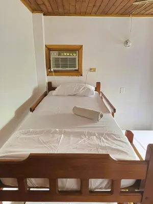a large bed in a room with a window at Amplio y Luminoso Apto en Tolú in Santiago