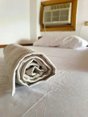 a towel sitting on top of a bed at Amplio y Luminoso Apto en Tolú in Santiago
