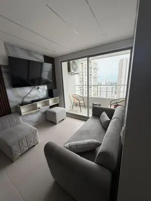 a living room with a couch and a large window at Cartagena Mood ON in Cartagena de Indias