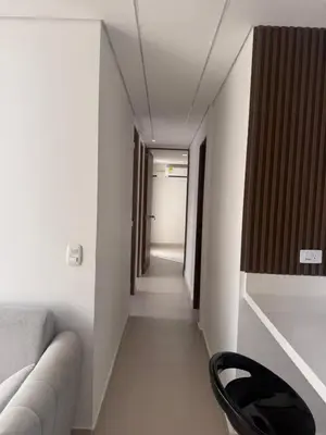 a hallway with a couch and a chair in a room at Cartagena Mood ON in Cartagena de Indias