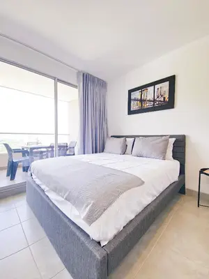 a large bed in a room with a large window at VILLA LILI Santa Marina Santa Marta in Santa Marta