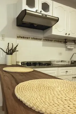 a kitchen with a wooden counter top with a hood at Hermoso apartamento cerca del Hotel Las Americas y Playa Azul in Cartagena de Indias