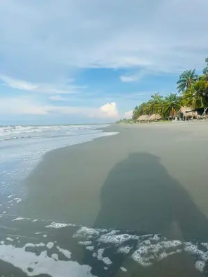 a shadow of a person on the beach at Refugio olgamar, Cabaña con kiosco cerca al mar in Moñitos