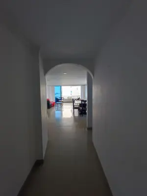 a hallway with a view of a living room and a dining room at Cartagena Beach con vista al mar in Cartagena de Indias