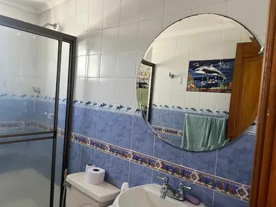 a bathroom with a mirror and a toilet and a sink at Mar del norte in Cartagena de Indias
