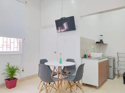 a kitchen with a table and chairs in a room at apto centro comodo 3 piso -- 1 in Cartagena de Indias