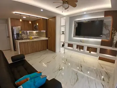 a living room with a couch and a flat screen tv at lindo departamento in Cartagena de Indias