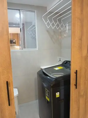 a kitchen with a trash can and a stove at lindo departamento in Cartagena de Indias