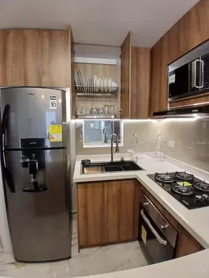 a kitchen with a stainless steel refrigerator and a sink at lindo departamento in Cartagena de Indias