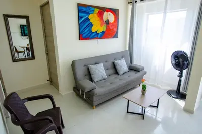a living room with a couch and a table at 2 double beds 2001 in Cartagena de Indias
