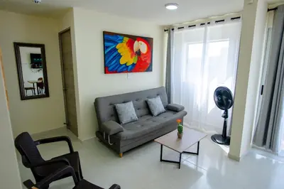 a living room with a couch and a table at 2 double beds 2001 in Cartagena de Indias