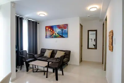 a living room with a couch and a table at Apartamento Cartagena Playa 2203 in Cartagena de Indias