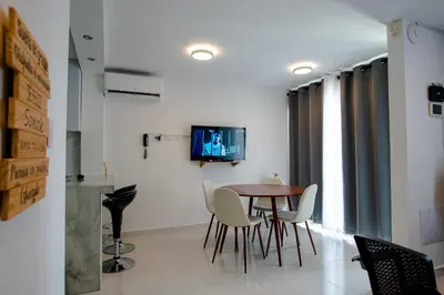 a dining room with a table and chairs at Apartamento Cartagena Playa 2203 in Cartagena de Indias