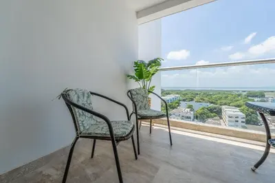 a room with two chairs and a table and a window at CB1043 | Suite premium en Cartagena hermosa vista in Cartagena de Indias