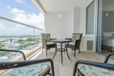 a balcony with a table and chairs and a view at CB1043 | Suite premium en Cartagena hermosa vista in Cartagena de Indias
