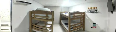 a small room with two bunk beds in it at casa perla del mar in Cartagena de Indias