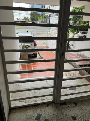 a sliding glass door looking out onto a street at Apartamento Vacacional en Bocagrande in Cartagena de Indias