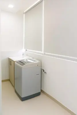 a white kitchen with a sink in a room at Apartamentos CP in Barranquilla
