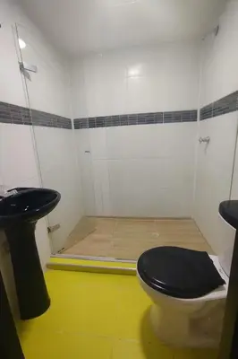 a bathroom with a toilet and a shower at Apartamentos CP in Barranquilla