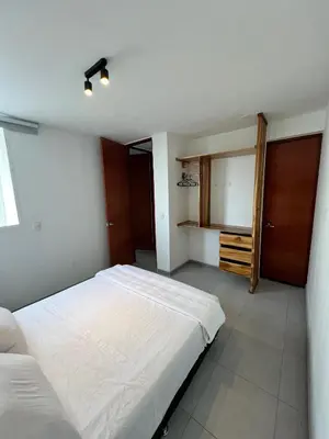 a bedroom with a large white bed in it at Apartamento cerca al mar y centro histórico in Cartagena de Indias
