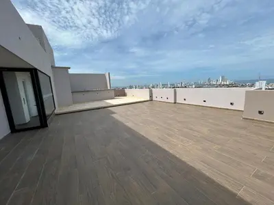 an empty rooftop of a building with a view of the city at Apartamento cerca al mar y centro histórico in Cartagena de Indias