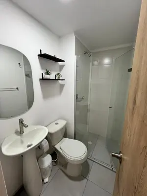 a bathroom with a toilet and a sink and a shower at Apartamento cerca al mar y centro histórico in Cartagena de Indias
