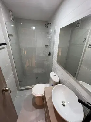 a bathroom with a shower and a toilet and a sink at Manglar - Ciudad Mallorquin in Puerto Colombia