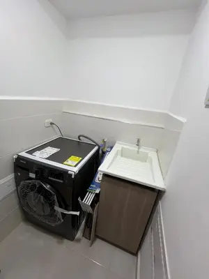 a washing machine in a room with a sink at Manglar - Ciudad Mallorquin in Puerto Colombia