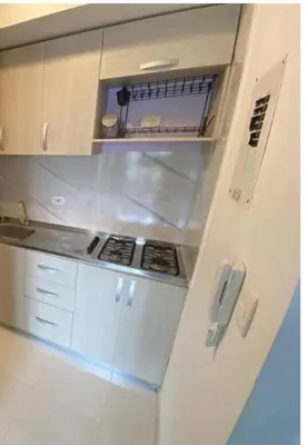 a white kitchen with a stove and a refrigerator at apartamento in Cartagena de Indias