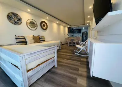 a bedroom with a bed and a living room at apartamento in Cartagena de Indias