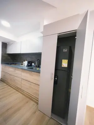 a kitchen with a door leading into a kitchen with a counter at Apartamento frente al mar in Cartagena de Indias
