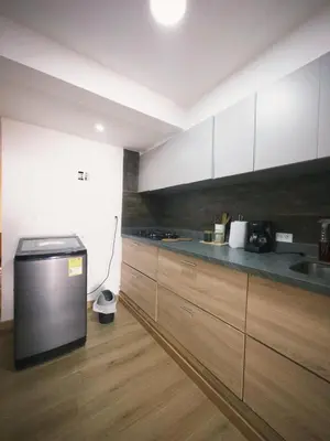 a kitchen with white cabinets and a counter top at Apartamento frente al mar in Cartagena de Indias