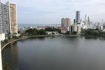 a large body of water in front of a city at Hermoso apartamento con vista en el laguito in Cartagena de Indias
