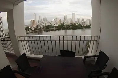 a balcony with a view of a river and buildings at Hermoso apartamento con vista en el laguito in Cartagena de Indias
