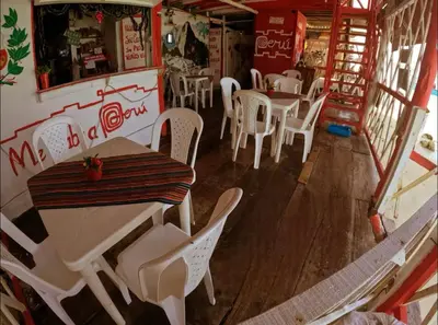 an overhead view of a restaurant with white tables and chairs at Machu Picchu - Barú in Playa Blanca