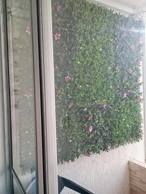 a hedge of pink flowers on a balcony at Live in the Heights Fresh and Bright Apartment in Cartagena de Indias