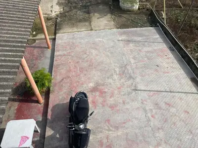 an overhead view of a motorcycle parked on a sidewalk at Villa Ana tu hogar lejos de casa in Coveñas