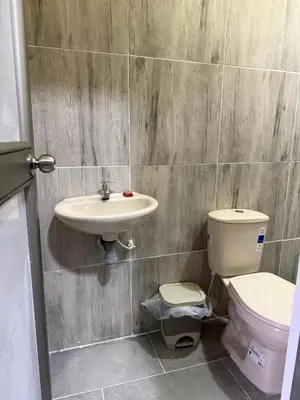 a bathroom with a sink and a toilet at Villa Ana tu hogar lejos de casa in Coveñas