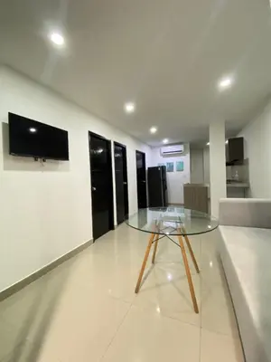 a glass table in the middle of a room at Apartamento para Grupos En La Boquilla BBB in Cartagena de Indias