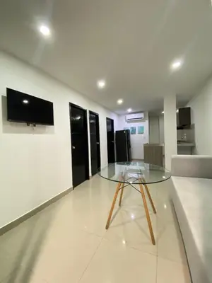 a glass table in the middle of a room at Apartamento Para 6 Pax En La Boquilla VIAMAR in Cartagena de Indias