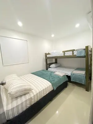a bedroom with two bunk beds in it at Apartamento Para 6 Pax En La Boquilla VIAMAR in Cartagena de Indias